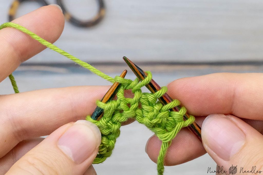 knitting across the wrong side in the fishermans rib stitch repeat