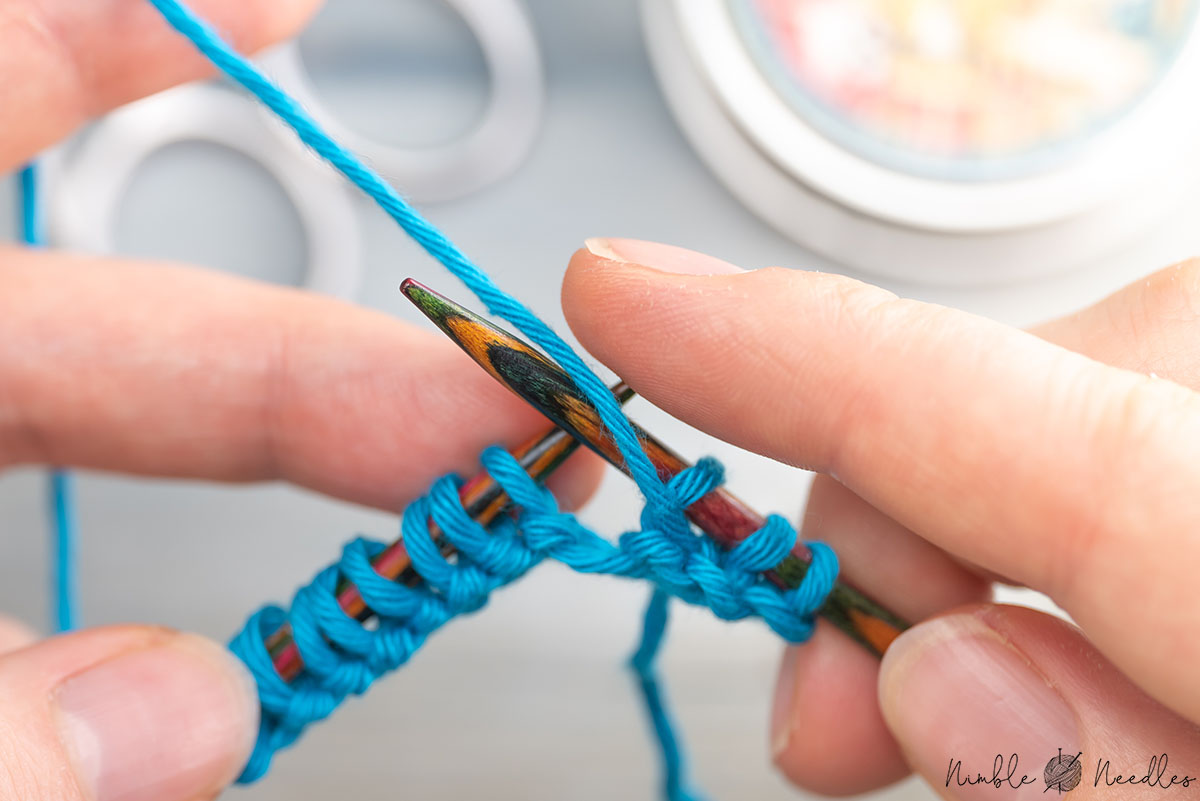 adding a yarnover on top of the slipped stitch