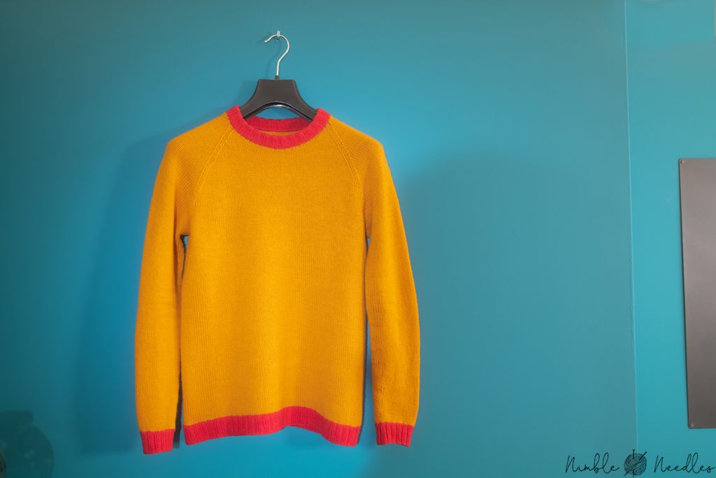 simple knitted raglan sweater on a hanger2