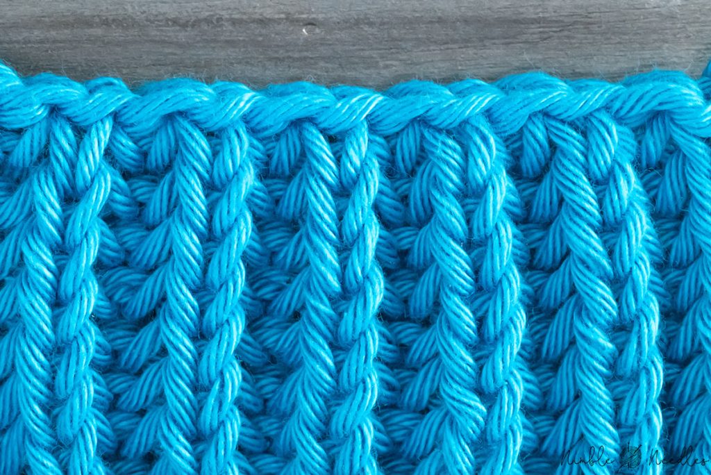 close up of an in pattern brioche stitch bind off edge