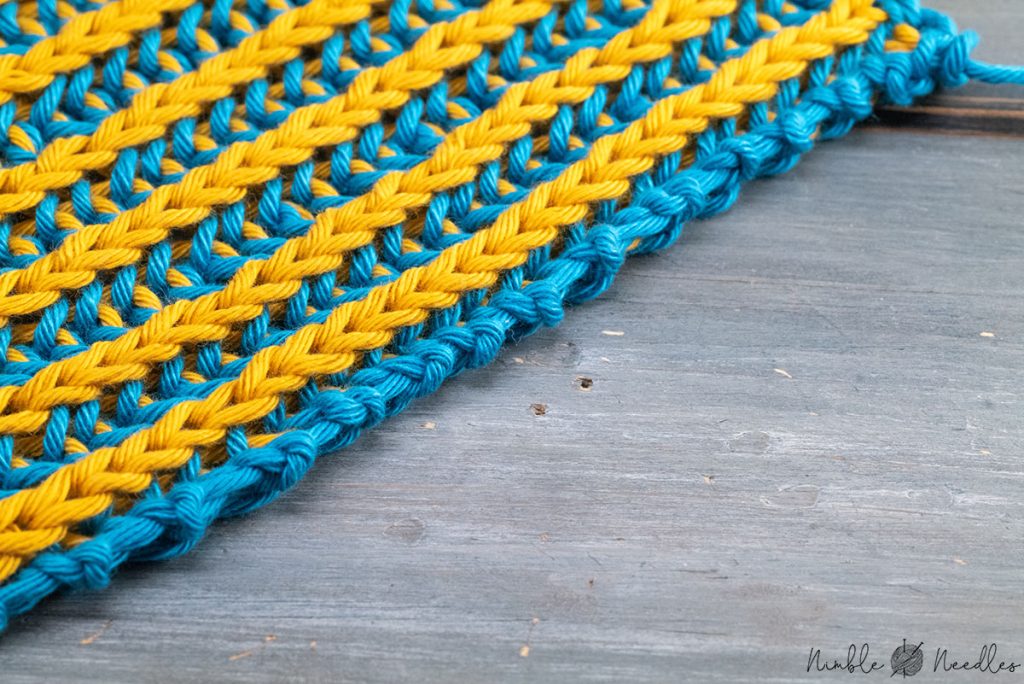close-up of a swatch in the brioche stitch in 2 colors with a garter stitch selvage