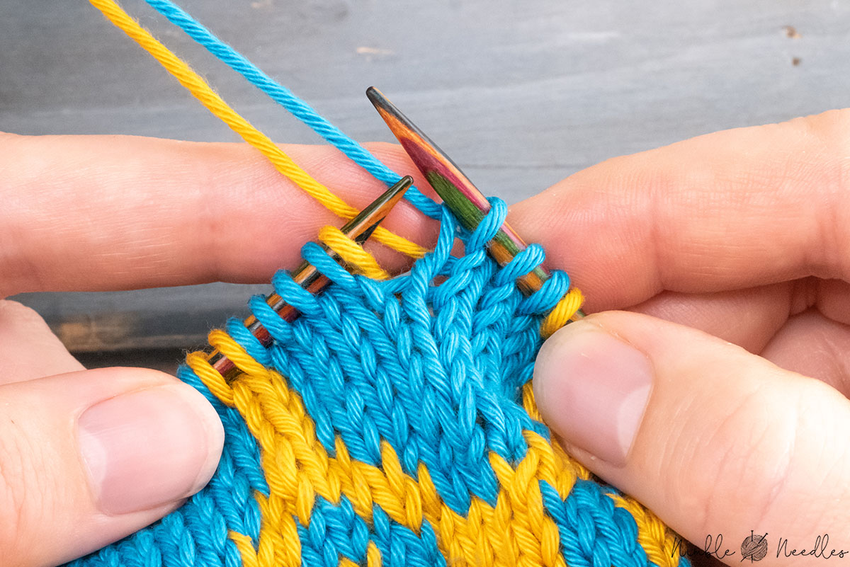 stopping right before the ladder back stitch with yarns held in back