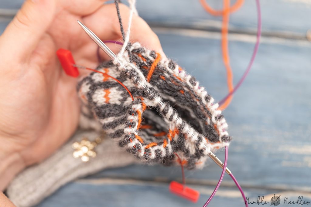 mittens work in progress - after having picked up the thumb stitches