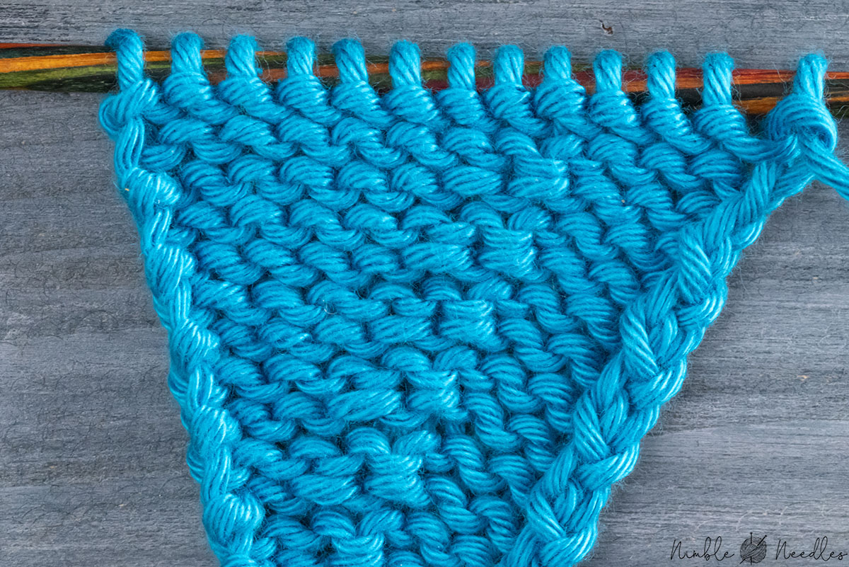 super close-up of the hitchknot increase purlwise