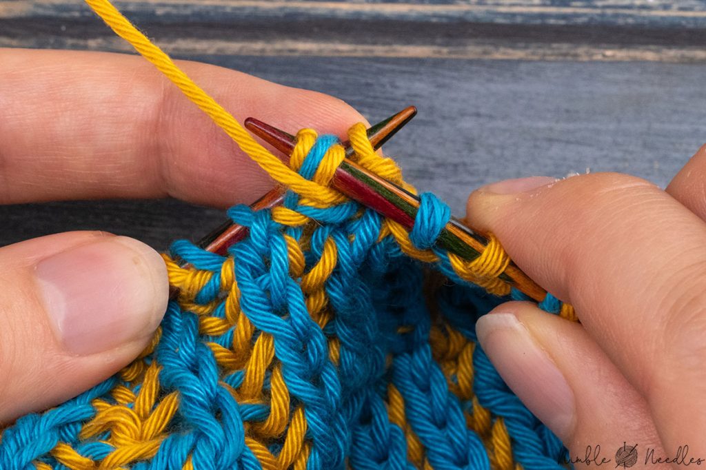 passing two double stitches over a single purl stitch