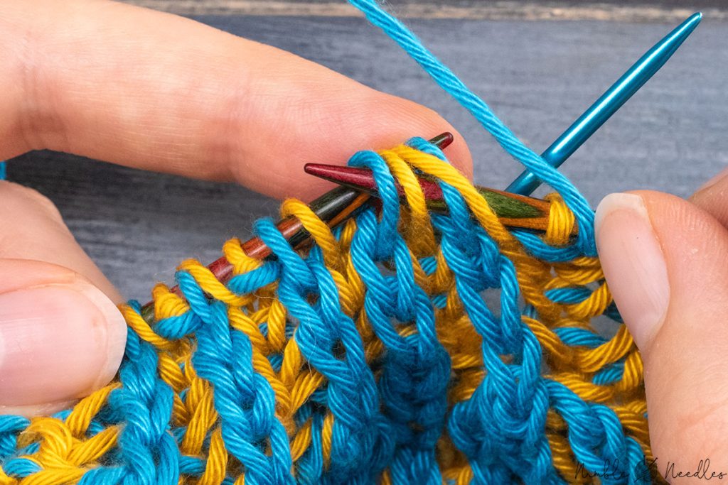 slipping back two double stitches to the left needle