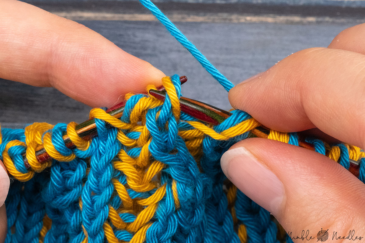 slipping the double stitch back to the left needle