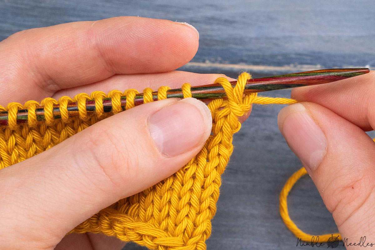 pulling tightly on the working yarn