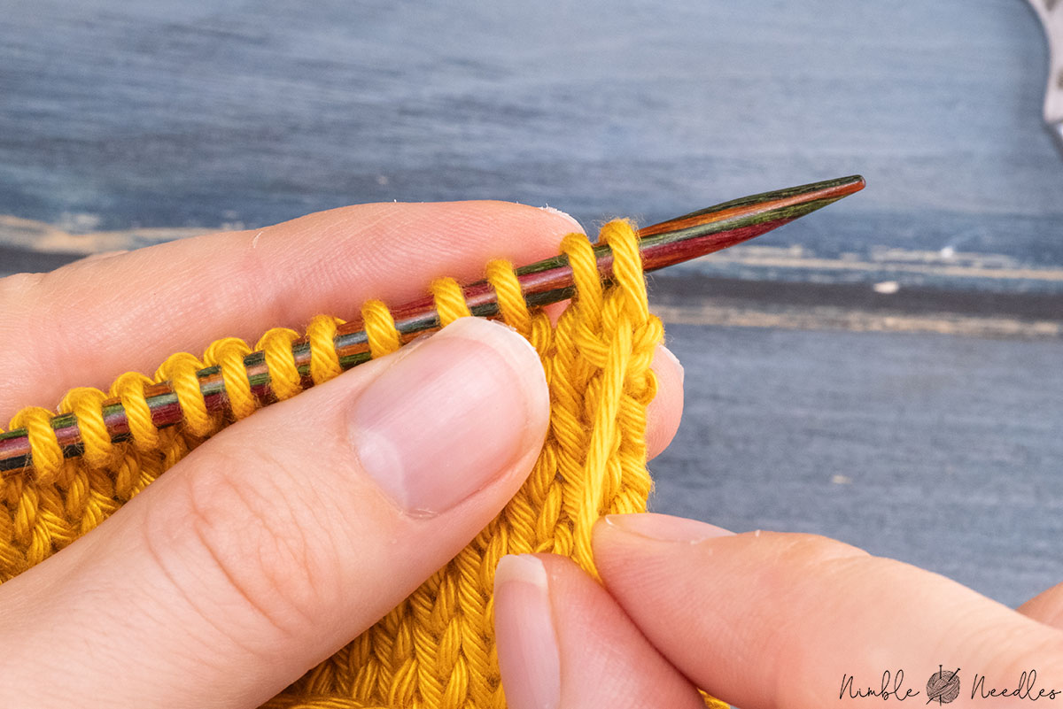 pulling tightly on the working yarn