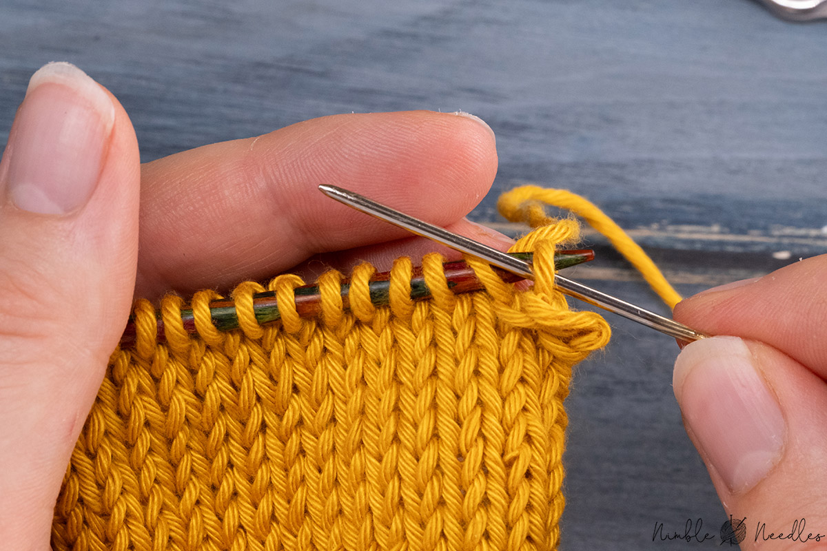 going into the new first stitch purlwise with the tapestry needle