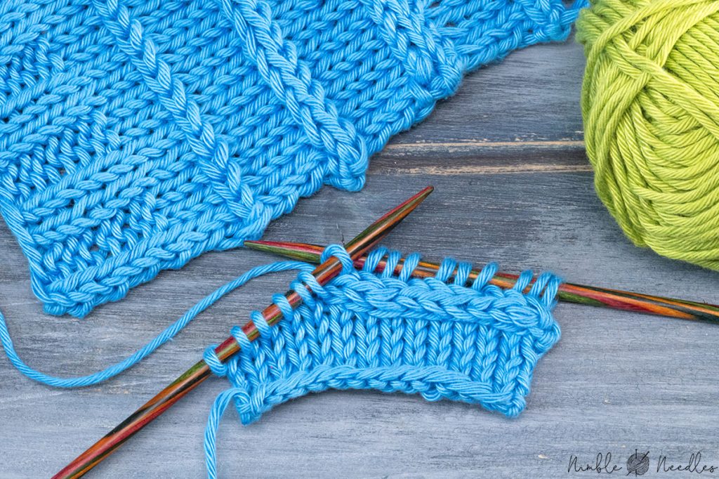 someone knitting a horizontal 2 stitch cable
