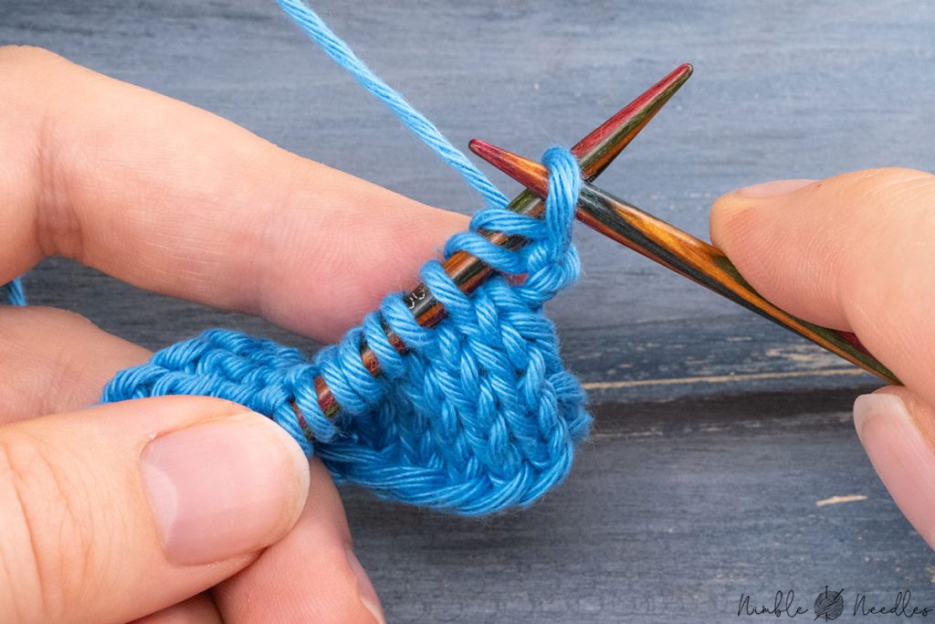 casting on two stitches with a knitted cast-on