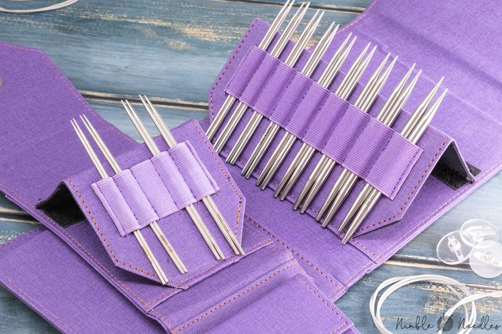 like flight interchangeable knitting needle sets on a wooden table